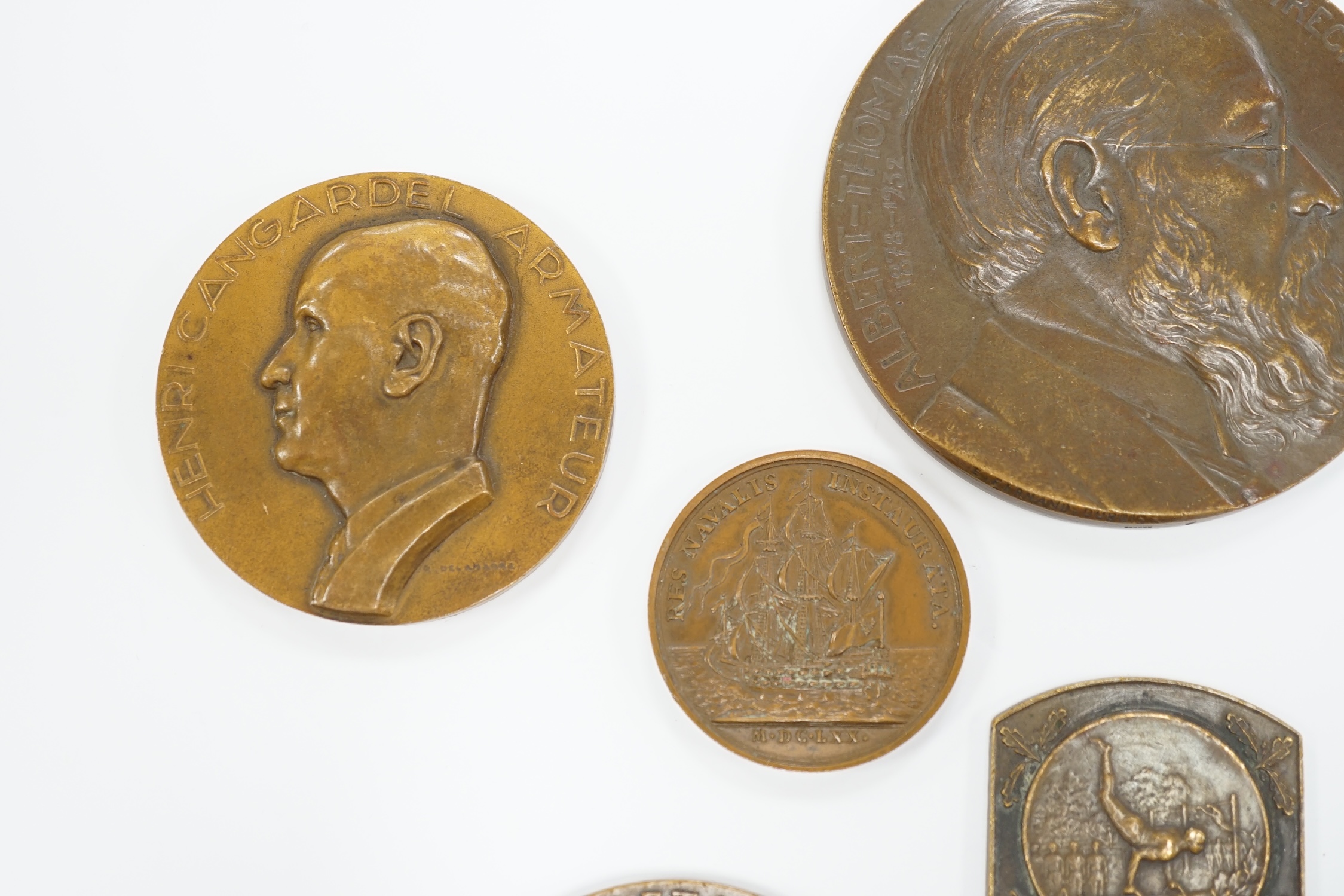 Seven bronze medallions, including awards and commemorative pieces; A.H. Johnson, Henri Cangardel, Albert Thomas, etc., largest 8 cm diameter